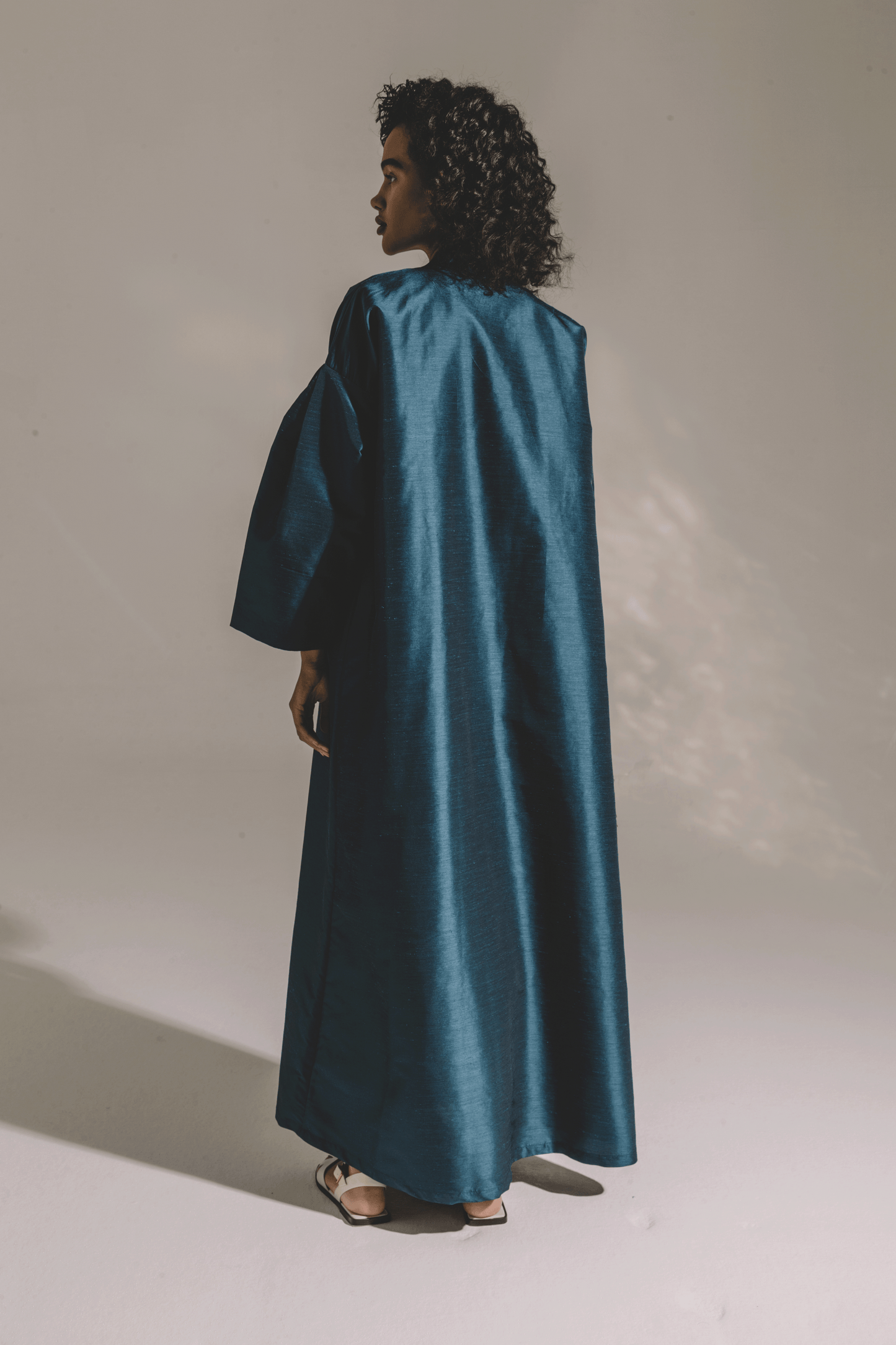 TEAL PLEATED SLEEVE IN COAT STYLE